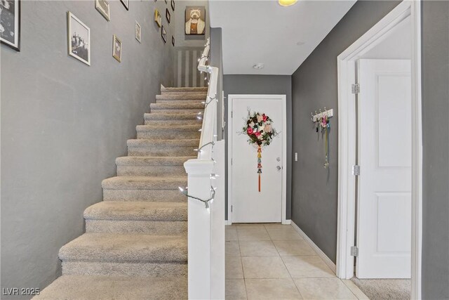 9050 W Tropicana Ave Unit 1027, Las Vegas, NV 89147 - staircase featuring tile patterned floors and baseboards