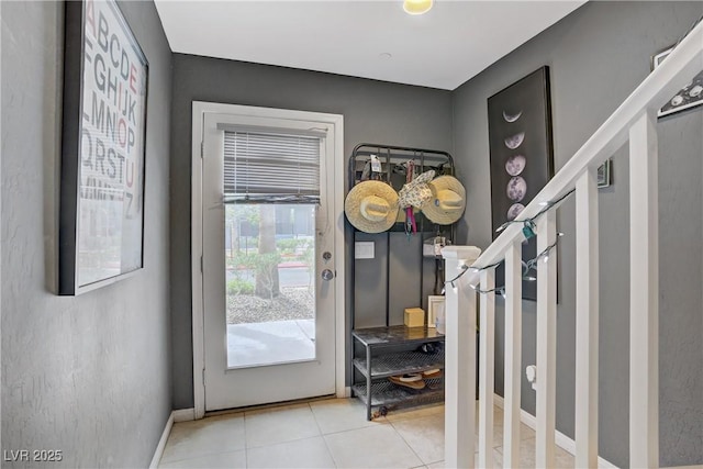 9050 W Tropicana Ave Unit 1027, Las Vegas, NV 89147 - entrance foyer featuring light tile patterned floors and baseboards