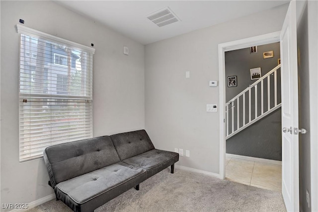9050 W Tropicana Ave Unit 1027, Las Vegas, NV 89147 - sitting room featuring carpet and stairs