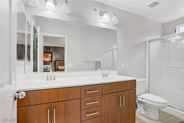 9050 W Tropicana Ave Unit 1027, Las Vegas, NV 89147 - full bath with double vanity, a shower with door, and tile patterned flooring