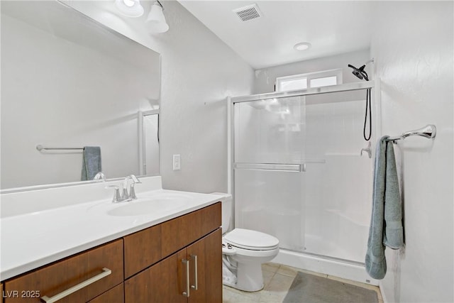 9050 W Tropicana Ave Unit 1027, Las Vegas, NV 89147 - full bathroom featuring a shower stall, vanity, and tile patterned flooring