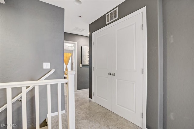 9050 W Tropicana Ave Unit 1027, Las Vegas, NV 89147 - hall featuring an upstairs landing and carpet