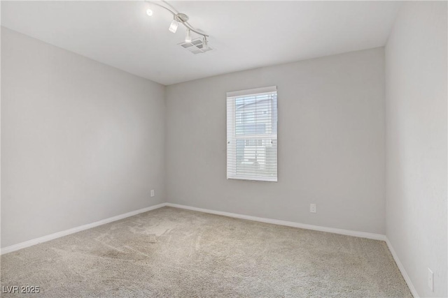9050 W Tropicana Ave Unit 1027, Las Vegas, NV 89147 - carpeted spare room featuring baseboards