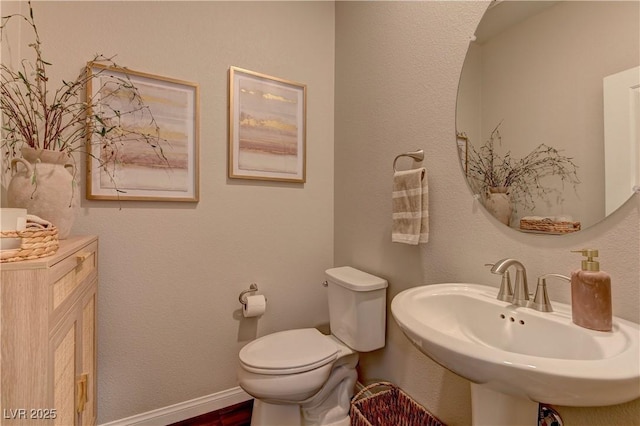 7705 Alder Forest St, Las Vegas, NV 89113 - half bath featuring a sink and wood finished floors