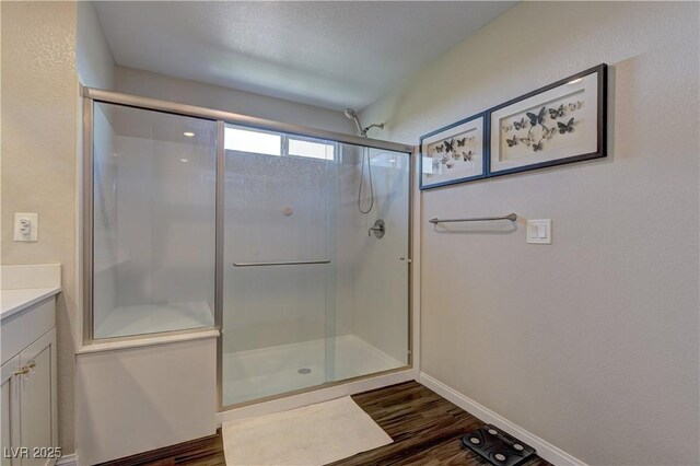 7705 Alder Forest St, Las Vegas, NV 89113 - full bath with a stall shower, vanity, and wood finished floors