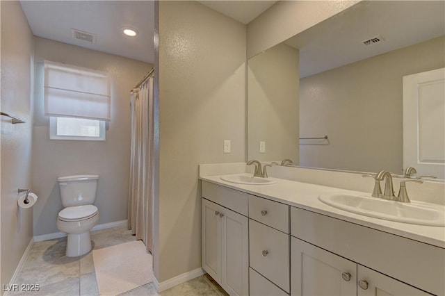 7705 Alder Forest St, Las Vegas, NV 89113 - bathroom with toilet and double vanity