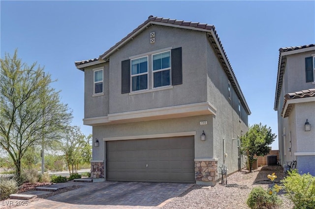 7705 Alder Forest St, Las Vegas, NV 89113 - view of front of house with stucco siding, stone siding, a garage, driveway, and a tile roof