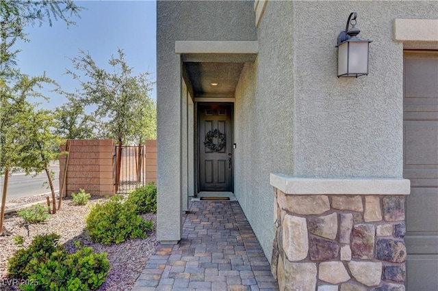 7705 Alder Forest St, Las Vegas, NV 89113 - doorway to property featuring stucco siding
