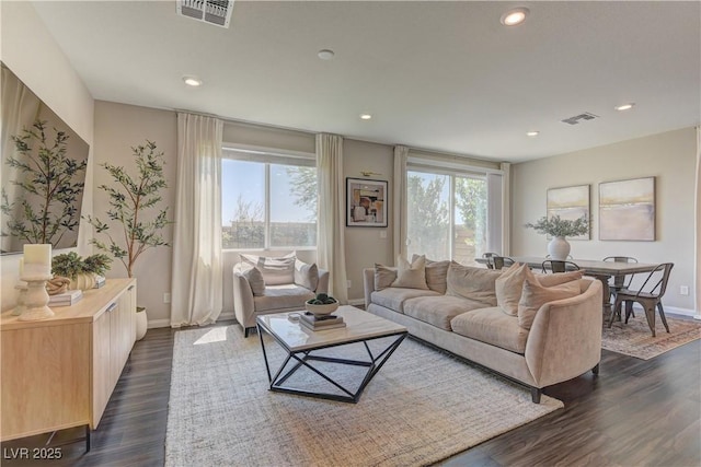 7705 Alder Forest St, Las Vegas, NV 89113 - living area with plenty of natural light, recessed lighting, and dark wood-style floors