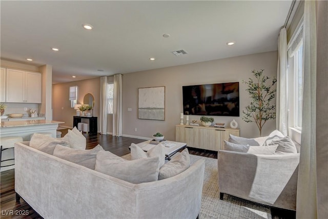 7705 Alder Forest St, Las Vegas, NV 89113 - living room with recessed lighting and dark wood-type flooring