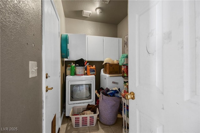 2500 Cortina Ave, Henderson, NV 89074 - laundry area with tile patterned floors, cabinet space, and washing machine and dryer