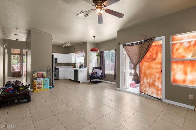 2500 Cortina Ave, Henderson, NV 89074 - living room featuring a ceiling fan, light tile patterned floors, and a textured ceiling