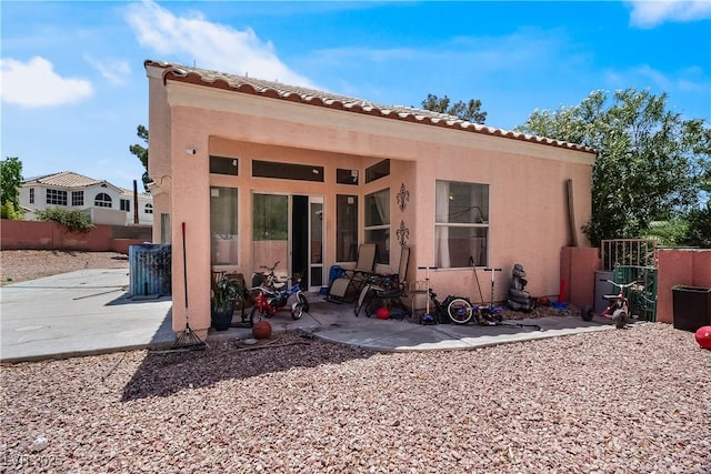 2500 Cortina Ave, Henderson, NV 89074 - rear view of house featuring stucco siding, a patio area, and a tile roof