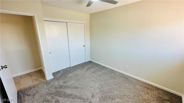 4238 Boratko St, Las Vegas, NV 89115 - unfurnished bedroom featuring carpet flooring, a closet, a textured ceiling, and ceiling fan