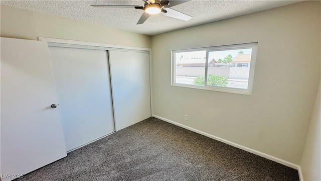 4238 Boratko St, Las Vegas, NV 89115 - unfurnished bedroom with dark carpet, a textured ceiling, a closet, and a ceiling fan