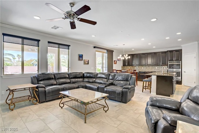 6489 Crest Estates St, Las Vegas, NV 89131 - living area with crown molding, recessed lighting, a chandelier, and ceiling fan