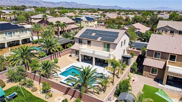6489 Crest Estates St, Las Vegas, NV 89131 - aerial perspective of suburban area with a pool and mountains