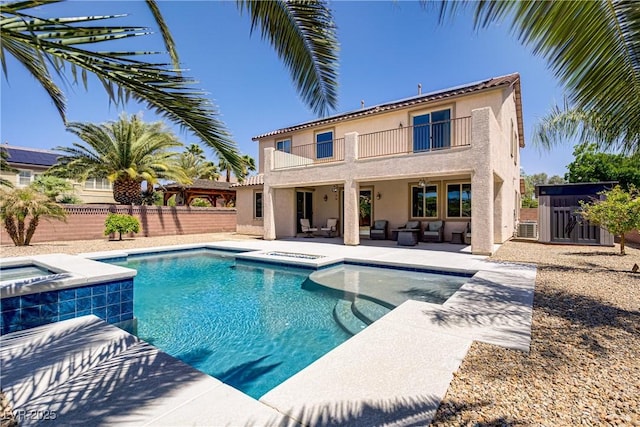 6489 Crest Estates St, Las Vegas, NV 89131 - view of pool featuring an in-ground hot tub, outdoor lounge area, a fenced backyard, and a patio area