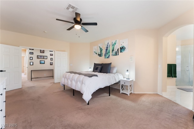 8605 Trianon Ln, Las Vegas, NV 89145 - bedroom with arched walkways, light colored carpet, and ceiling fan