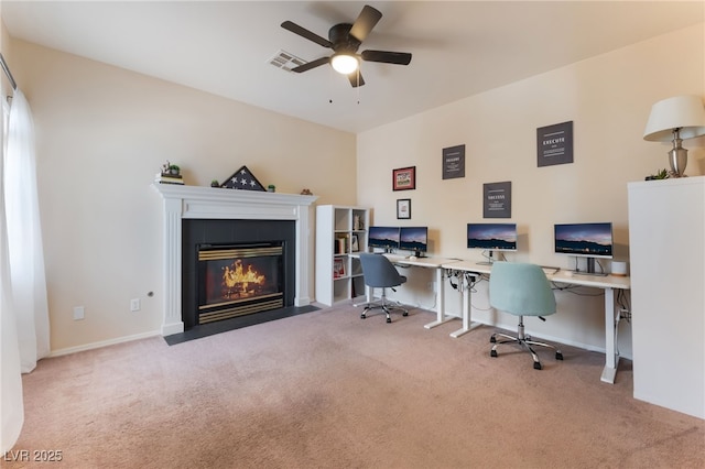 8605 Trianon Ln, Las Vegas, NV 89145 - carpeted office featuring ceiling fan and a fireplace with flush hearth