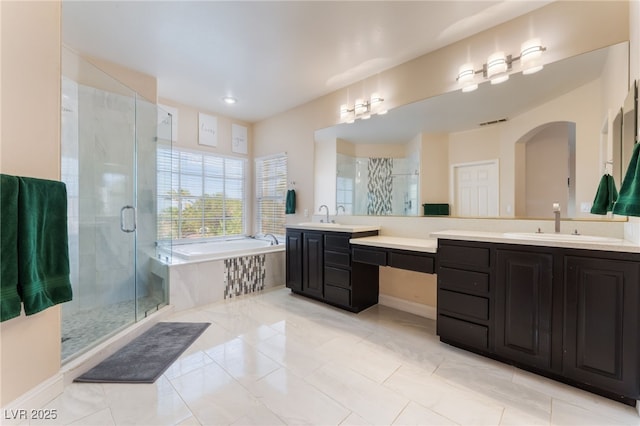 8605 Trianon Ln, Las Vegas, NV 89145 - bathroom with vanity, a garden tub, a stall shower, and recessed lighting