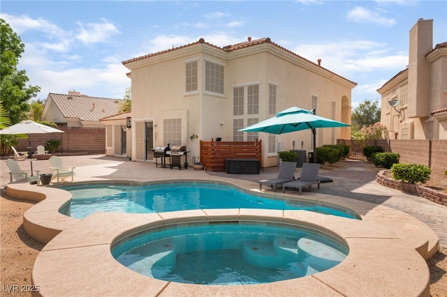8605 Trianon Ln, Las Vegas, NV 89145 - view of pool featuring a patio area, a fenced backyard, and a pool with connected hot tub