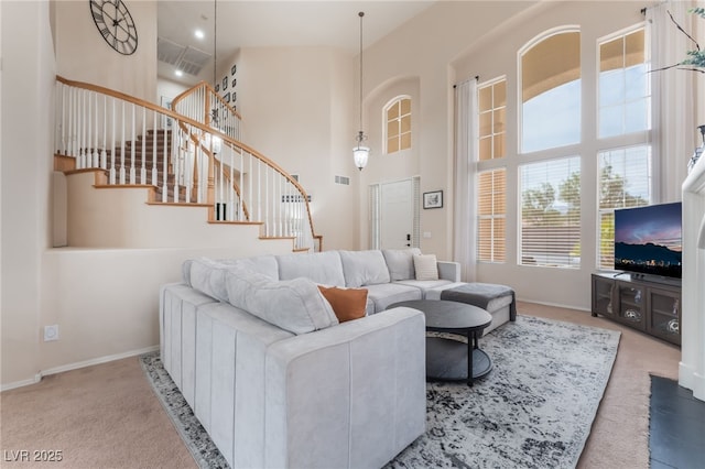 8605 Trianon Ln, Las Vegas, NV 89145 - carpeted living room with a towering ceiling and stairs