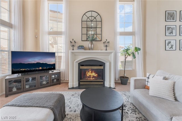 8605 Trianon Ln, Las Vegas, NV 89145 - living area with plenty of natural light and a fireplace with flush hearth