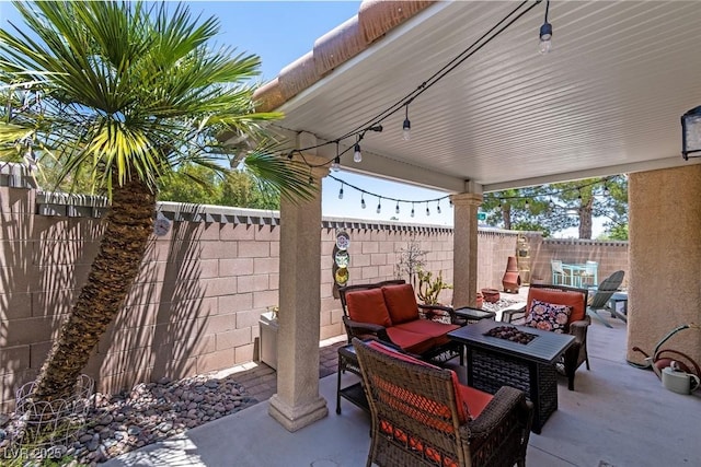 10352 Natural Springs Ave, Las Vegas, NV 89129 - fenced backyard featuring a patio area and an outdoor living space with a fire pit