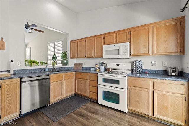 10352 Natural Springs Ave, Las Vegas, NV 89129 - kitchen featuring white appliances, dark countertops, a ceiling fan, and dark wood-style flooring
