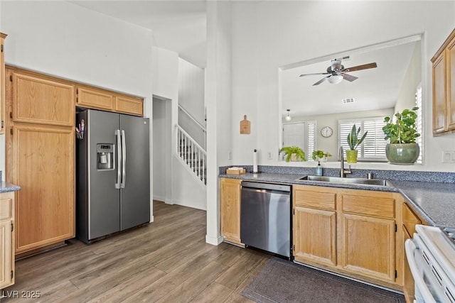 10352 Natural Springs Ave, Las Vegas, NV 89129 - kitchen with stainless steel appliances, ceiling fan, dark wood-style flooring, and dark countertops