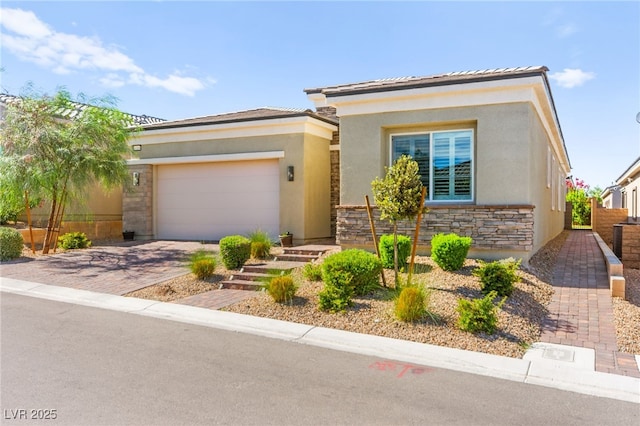 10160 Tree Blossom Ave, Las Vegas, NV 89166 - view of front of home featuring stucco siding, a garage, stone siding, and driveway