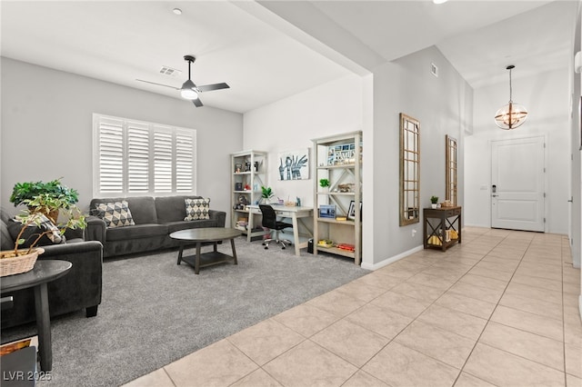 10160 Tree Blossom Ave, Las Vegas, NV 89166 - living area featuring light tile patterned floors, light colored carpet, a ceiling fan, a towering ceiling, and a chandelier