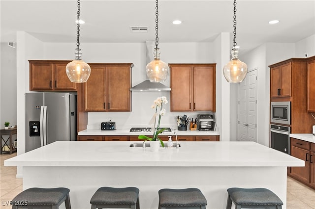10160 Tree Blossom Ave, Las Vegas, NV 89166 - kitchen with stainless steel appliances, light tile patterned floors, a kitchen bar, a kitchen island with sink, and recessed lighting