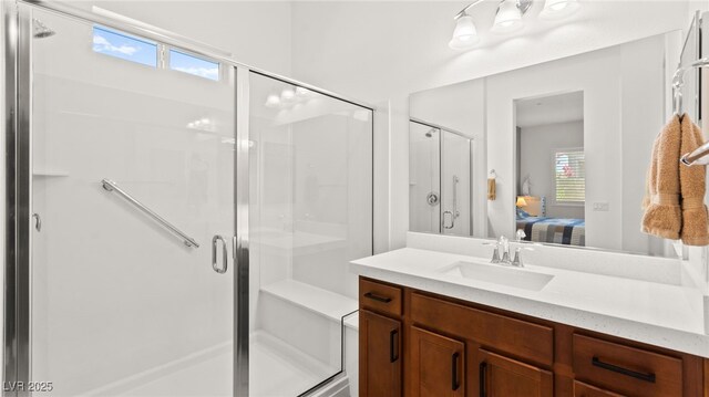 10160 Tree Blossom Ave, Las Vegas, NV 89166 - full bath featuring connected bathroom, vanity, a stall shower, and plenty of natural light
