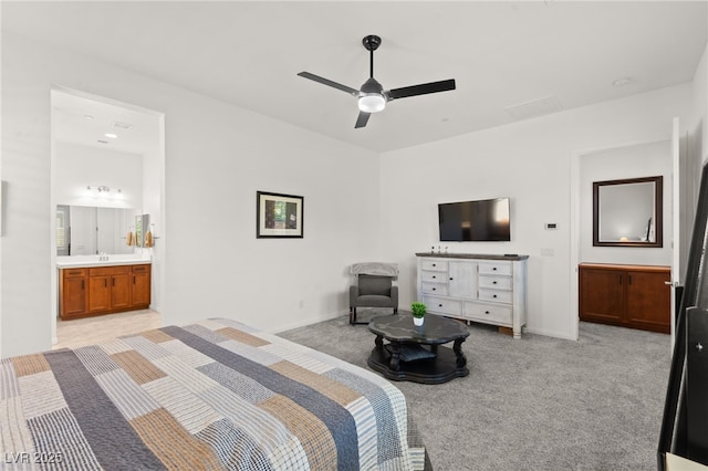 10160 Tree Blossom Ave, Las Vegas, NV 89166 - bedroom featuring light colored carpet, connected bathroom, and a ceiling fan