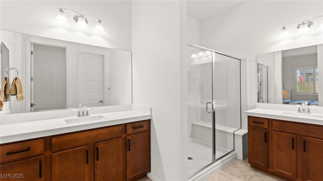 10160 Tree Blossom Ave, Las Vegas, NV 89166 - bathroom featuring a shower stall, vanity, and tile patterned floors