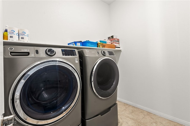 10160 Tree Blossom Ave, Las Vegas, NV 89166 - laundry room with washer and clothes dryer and tile patterned floors