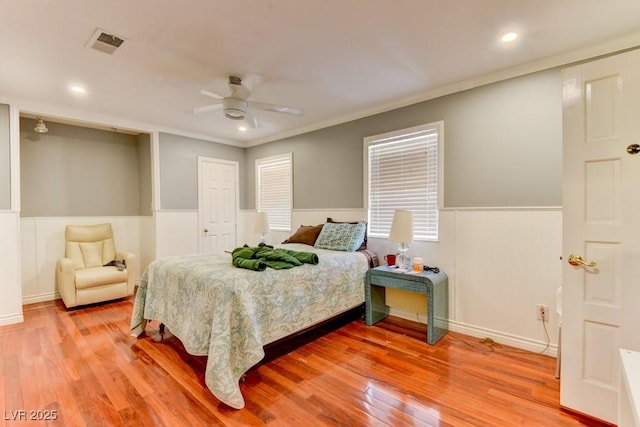 1818 Waldman Ave, Las Vegas, NV 89102 - bedroom with a wainscoted wall, light wood-style floors, ornamental molding, and ceiling fan