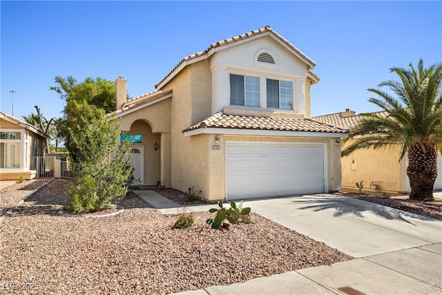 5332 Desert Blossom Rd, Las Vegas, NV 89107 - view of front facade featuring a tiled roof, stucco siding, a garage, and concrete driveway