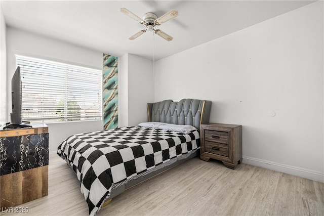 5332 Desert Blossom Rd, Las Vegas, NV 89107 - bedroom with light wood-style floors and ceiling fan