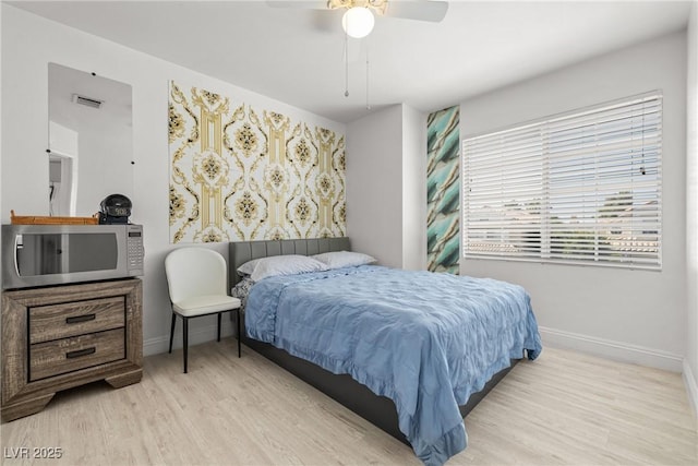 5332 Desert Blossom Rd, Las Vegas, NV 89107 - bedroom featuring wood finished floors and ceiling fan