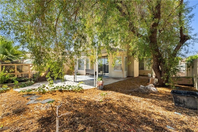 5332 Desert Blossom Rd, Las Vegas, NV 89107 - back of house featuring a patio and stucco siding