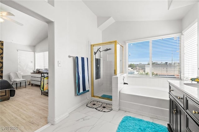 5332 Desert Blossom Rd, Las Vegas, NV 89107 - full bath featuring vaulted ceiling, a stall shower, a bath, plenty of natural light, and vanity