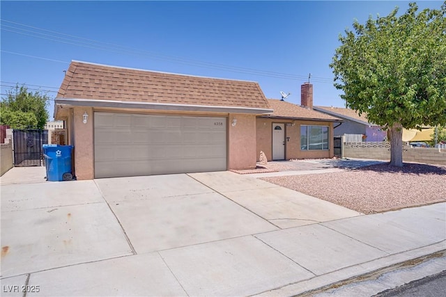 6358 Meadow Lark Ln, Las Vegas, NV 89103 - view of front facade with a shingled roof, a garage, driveway, stucco siding, and a chimney