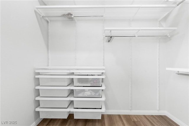 5936 Bruselas St, Las Vegas, NV 89113 - spacious closet with wood finished floors