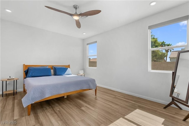 5936 Bruselas St, Las Vegas, NV 89113 - bedroom featuring multiple windows, wood finished floors, recessed lighting, and ceiling fan