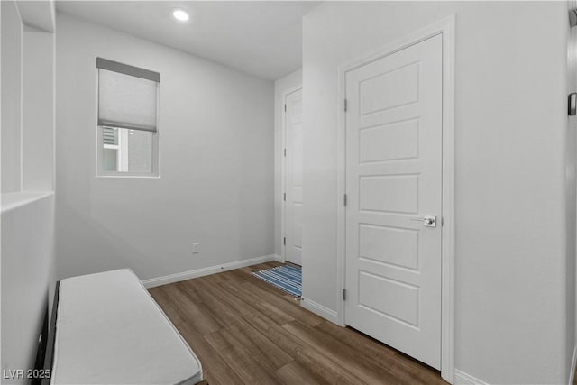 5936 Bruselas St, Las Vegas, NV 89113 - empty room with dark wood-style flooring and recessed lighting