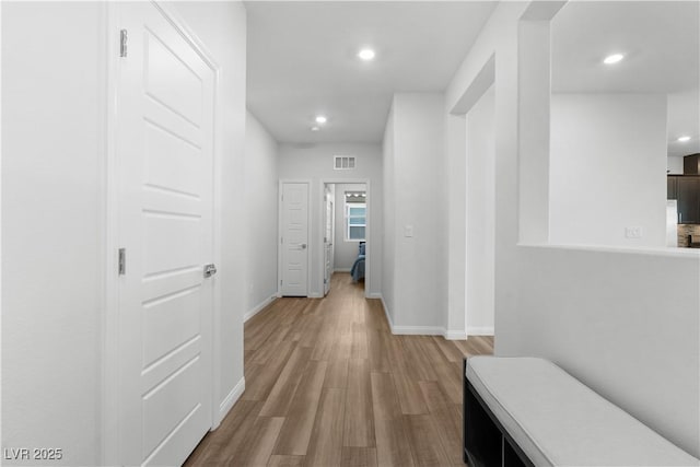 5936 Bruselas St, Las Vegas, NV 89113 - corridor with recessed lighting and wood finished floors