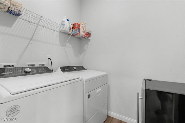 5936 Bruselas St, Las Vegas, NV 89113 - laundry area with washer and dryer and wood finished floors